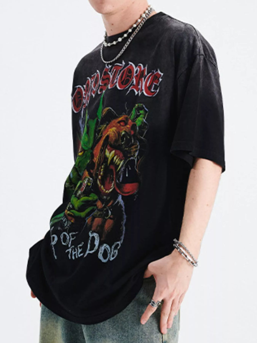 Person wearing a black t-shirt with graphic design and text-Black Orvani