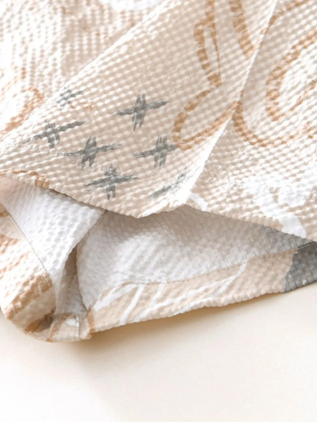 Textured fabric with star pattern on a white background-blackorvani.com