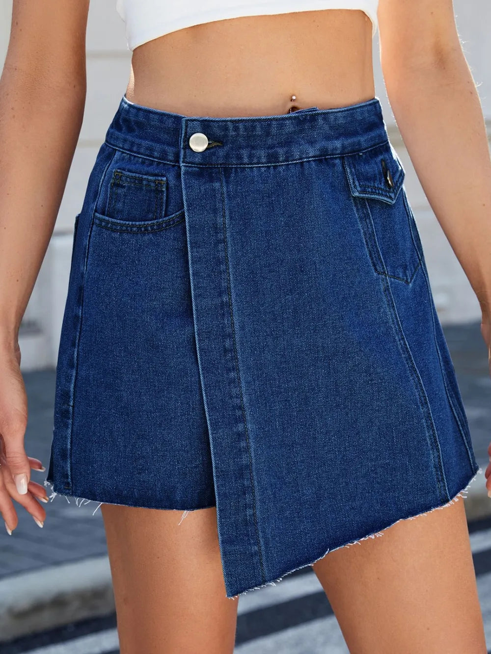 Blue denim skirt worn by a person with a blurred background-bblackorvani