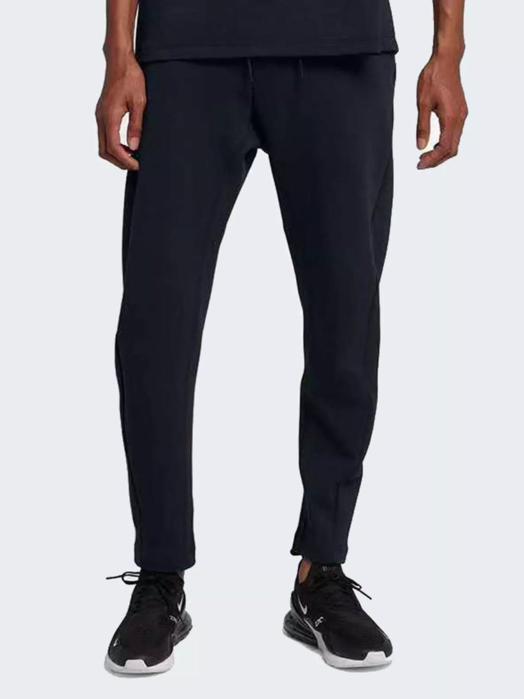 Person wearing black pants and black shoes on a white background-BlackOrvani