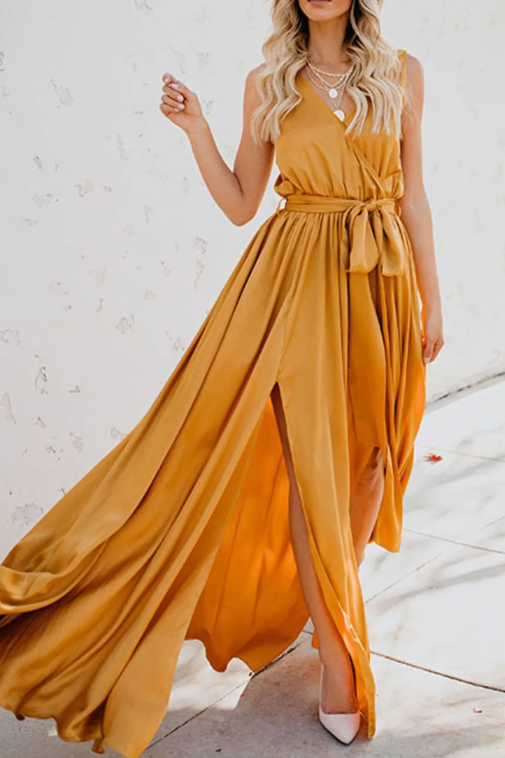 Woman wearing a mustard yellow dress with a white background-blackorvani.com