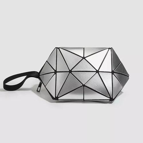 Geometrically designed bag with a black strap on a light gray -Black saddle bag with a gray cover on a white surface background-Black saddle bag with a gray cover on a white surface-BLACKOrVaNi