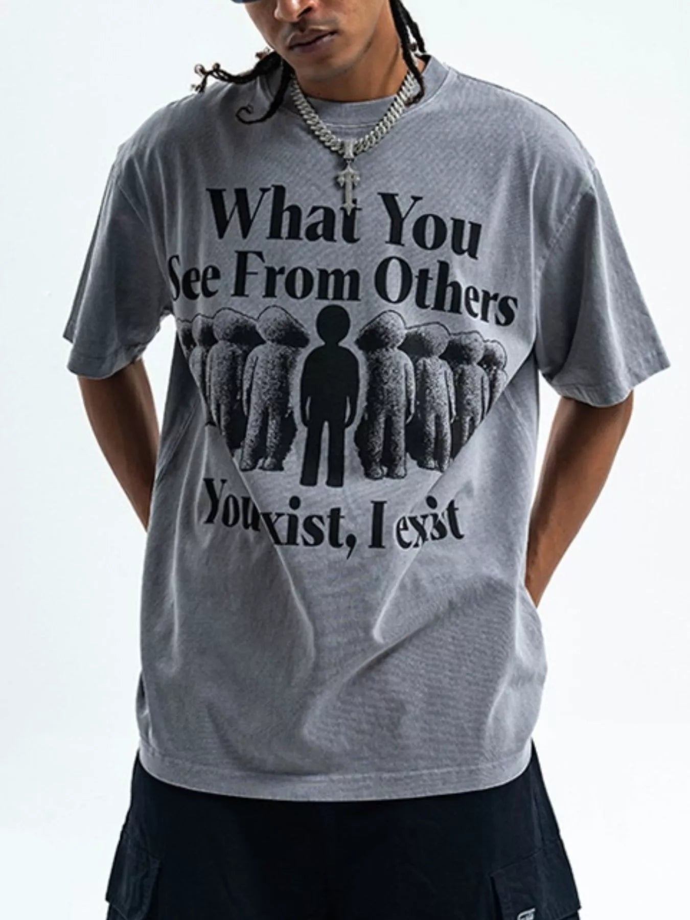 Person wearing a gray t-shirt with a motivational quote and graphic design-blackorvani.com