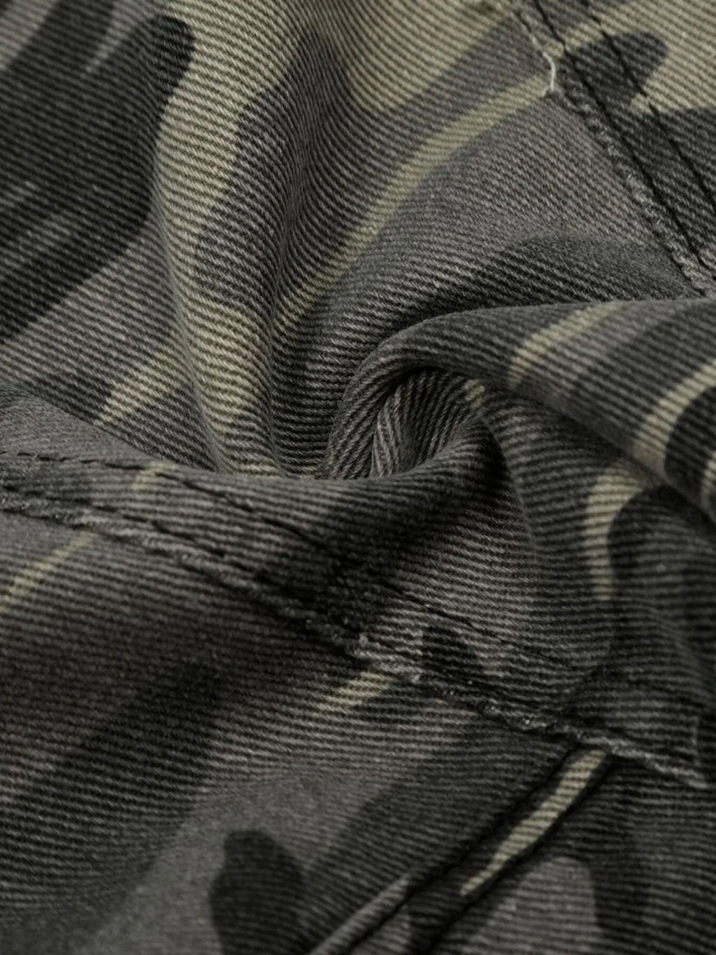Close-up of camouflage fabric with a focus on texture and pattern-Black Orvani