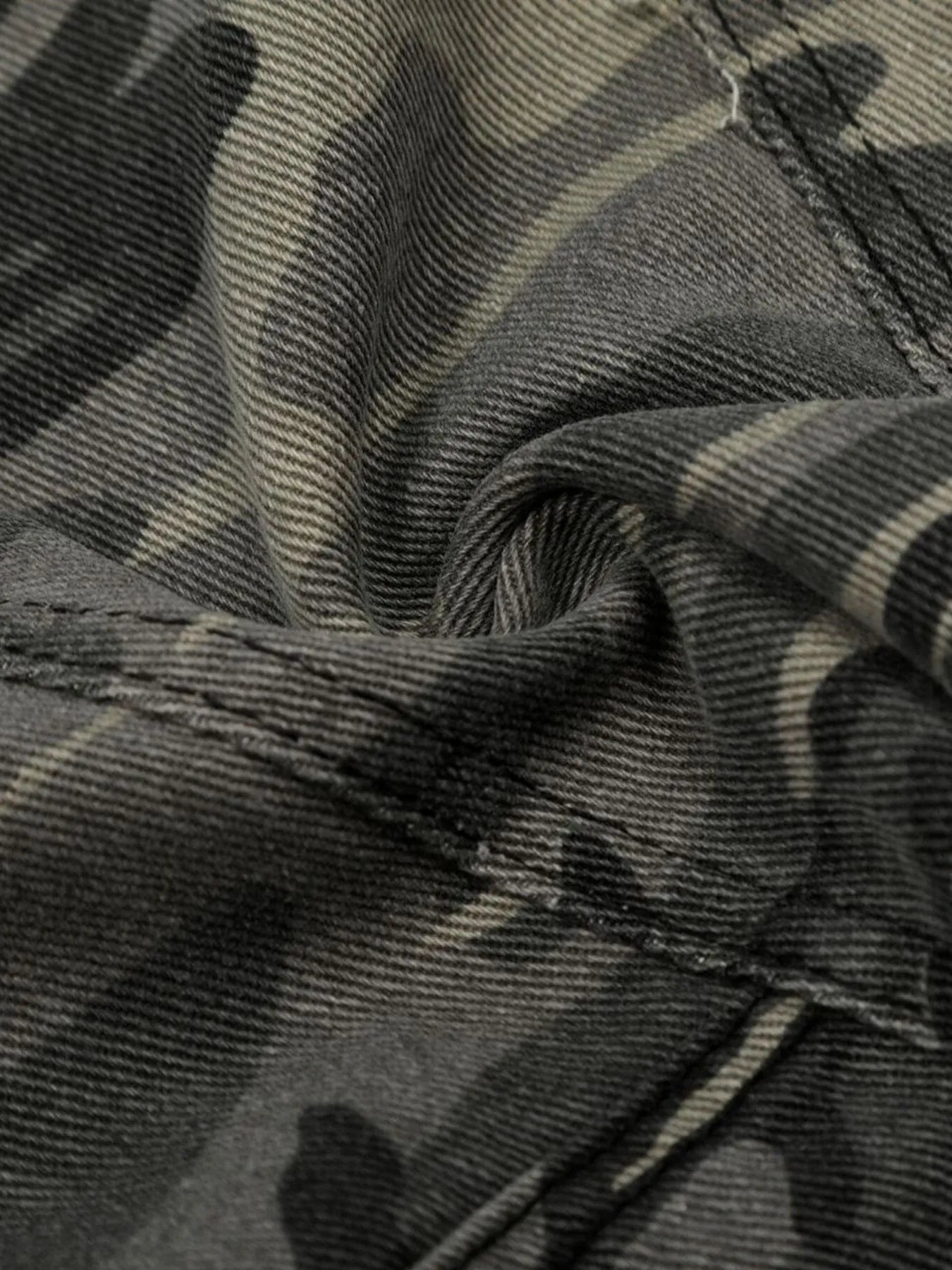 Close-up of camouflage fabric with a focus on texture and pattern-Black Orvani