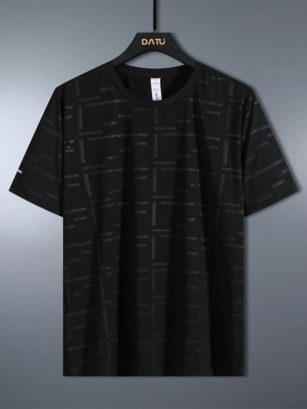 Black patterned t-shirt on a hanger with 'DATU' branding against a gray background-blackorvani.com