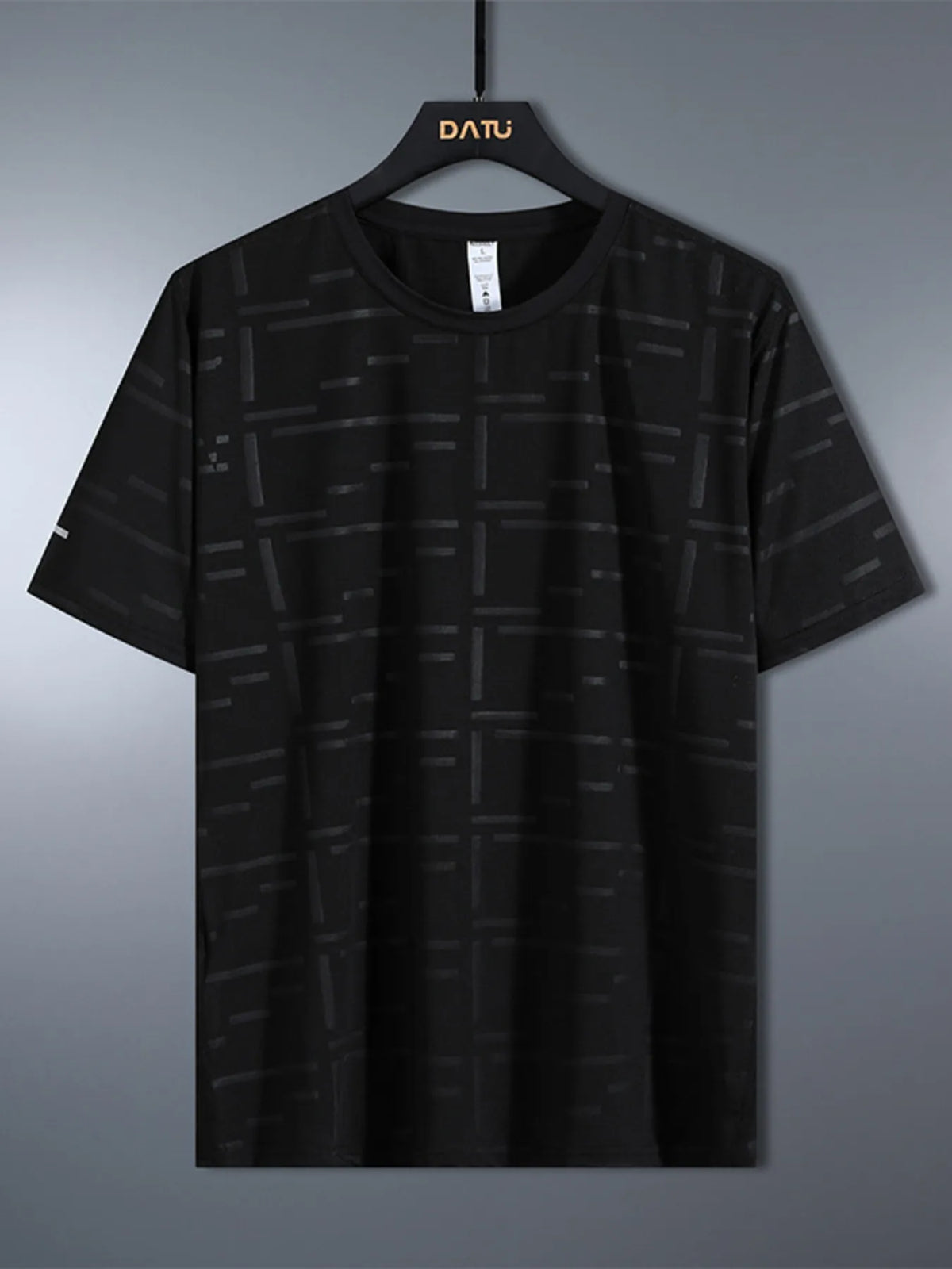 Black patterned t-shirt on a hanger with 'DATU' branding against a gray background-blackorvani.com