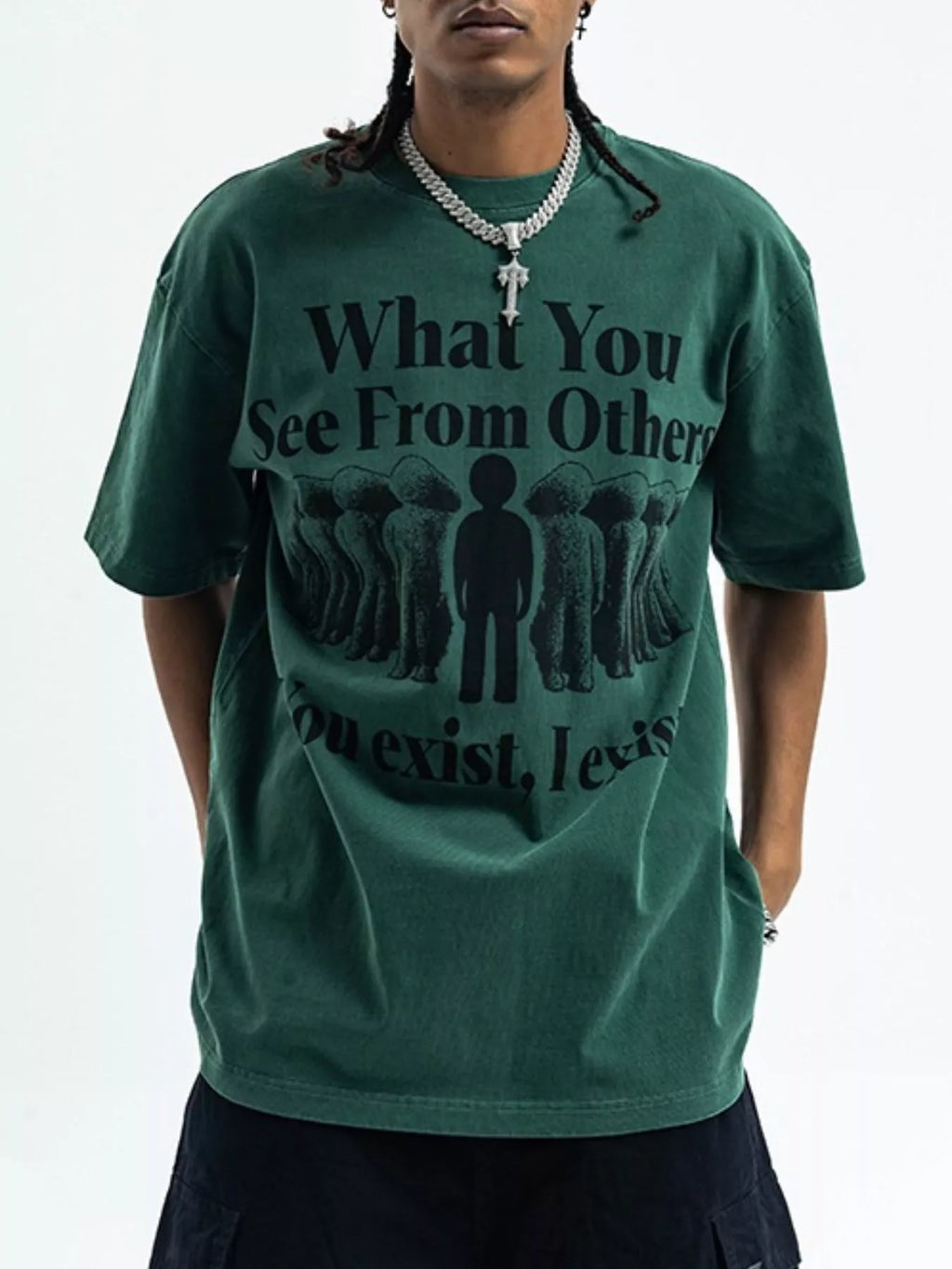Person wearing a green t-shirt with a motivational quote on a plain background-blackorvani.com