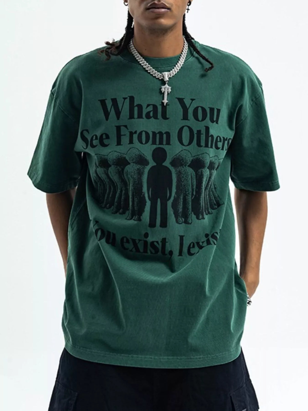 Person wearing a green t-shirt with a motivational quote on a plain background-blackorvani.com