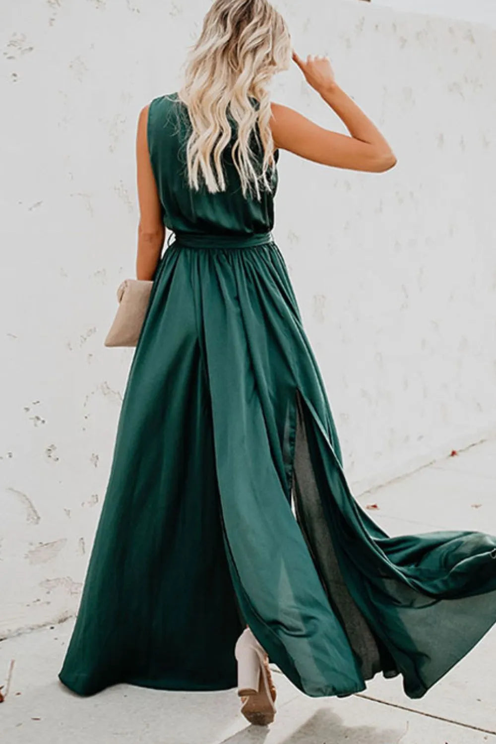 Woman wearing a green dress with a plain background-blackorvani.com