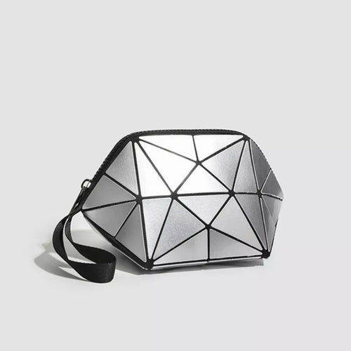 Geometrically patterned bag on a light gray background-Black saddle bag with a gray cover on a white surface-BLACKOrVaNi