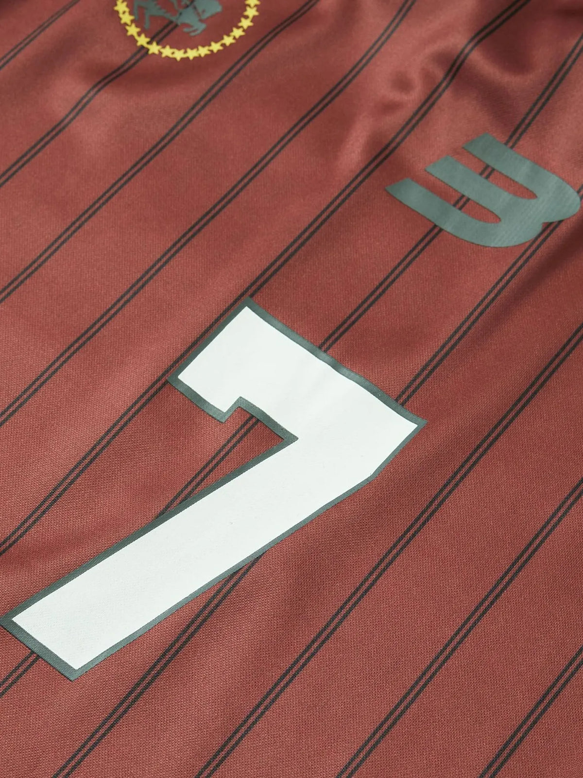 Maroon sports jersey with number 7 and logo on a striped background-blackorvani.com