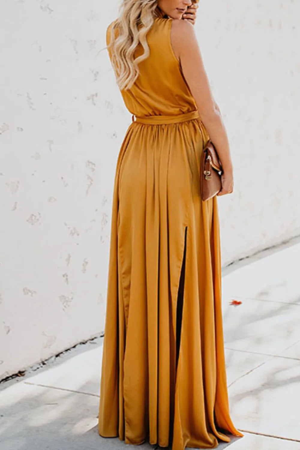 Woman wearing a mustard yellow dress with a white background-blackorvani.com