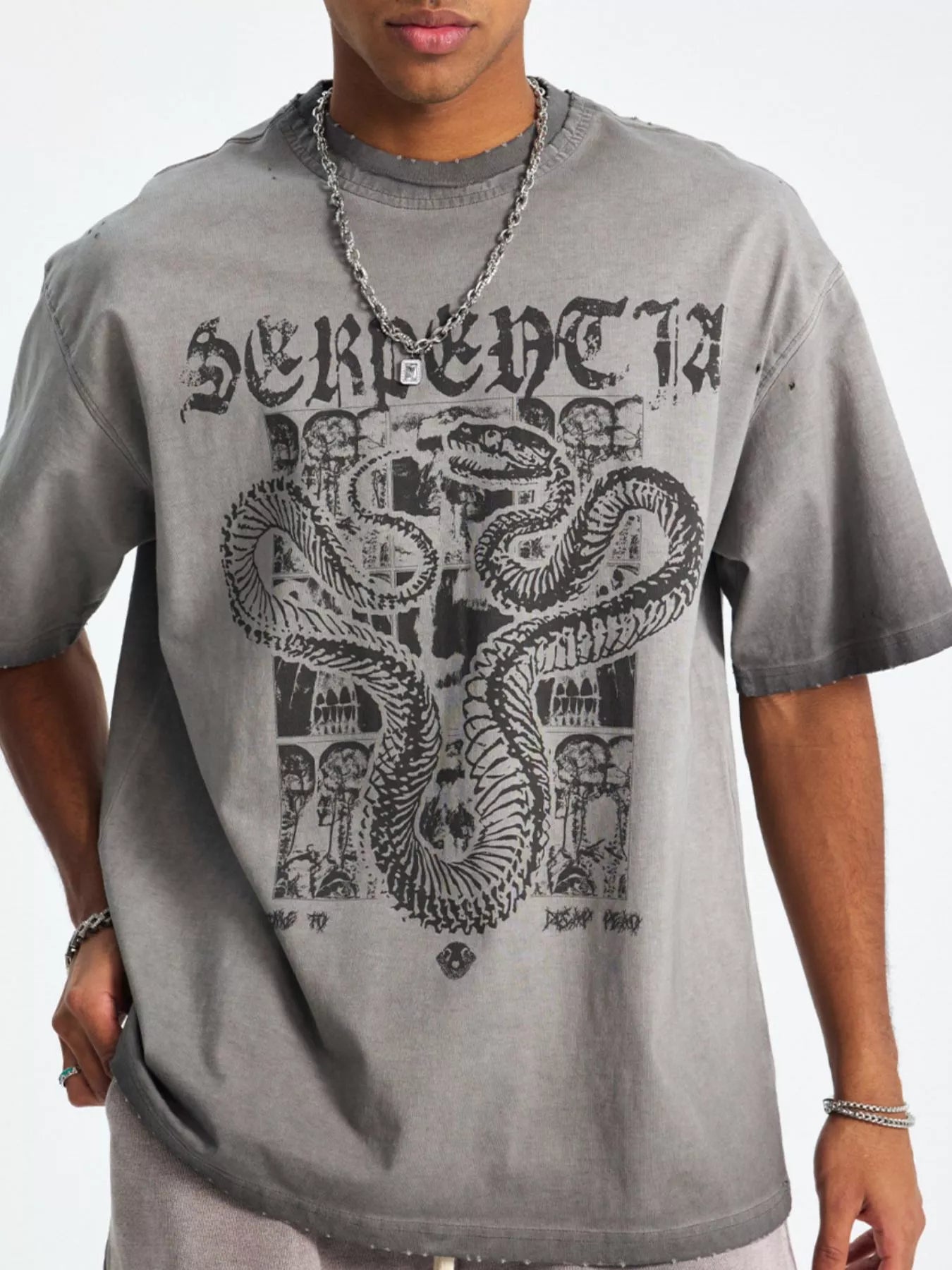 women wearing a gray t-shirt with a snake design and 'SERPENTIA' text-Black Orvani