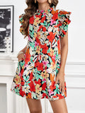 Woman wearing a colorful floral dress with a white background-BlackOrvani