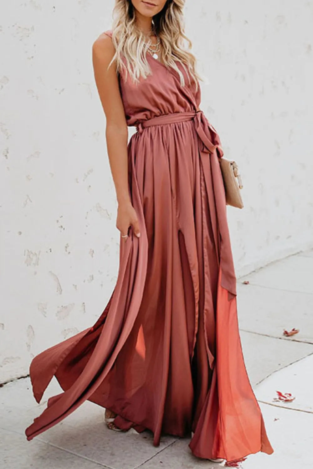 Woman wearing a long rust-colored dress against a white background-blackorvani.com