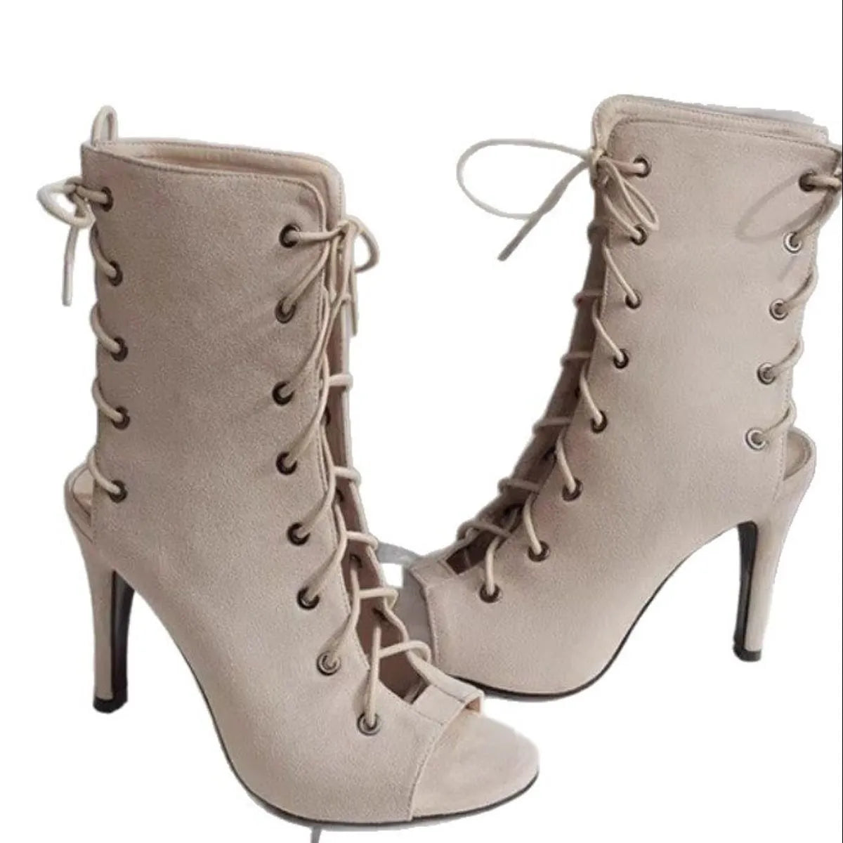Pair of beige high-heeled lace-up boots on a white background