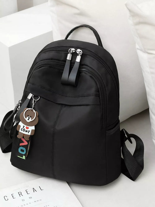Black backpack with a keychain on a white surface-BlackOrvani
