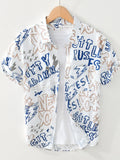 White shirt with blue and brown text and graphics on a hanger against a white background-blackorvani.com