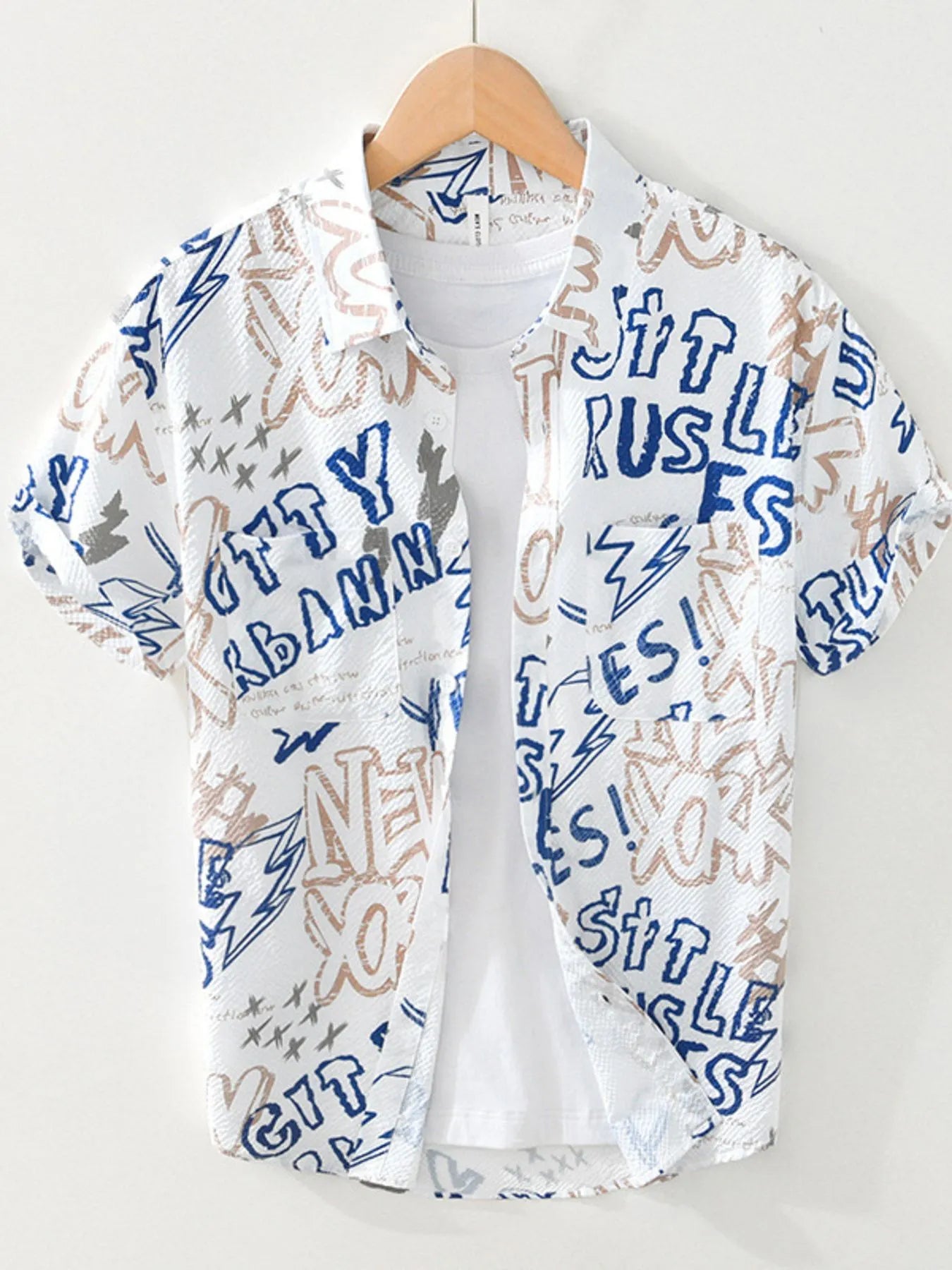 White shirt with blue and brown text and graphics on a hanger against a white background-blackorvani.com