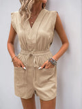 Woman wearing a beige sleeveless jumpsuit against a plain background Women's Black Sequin High-Slit Evening Dress-Black Orvani 