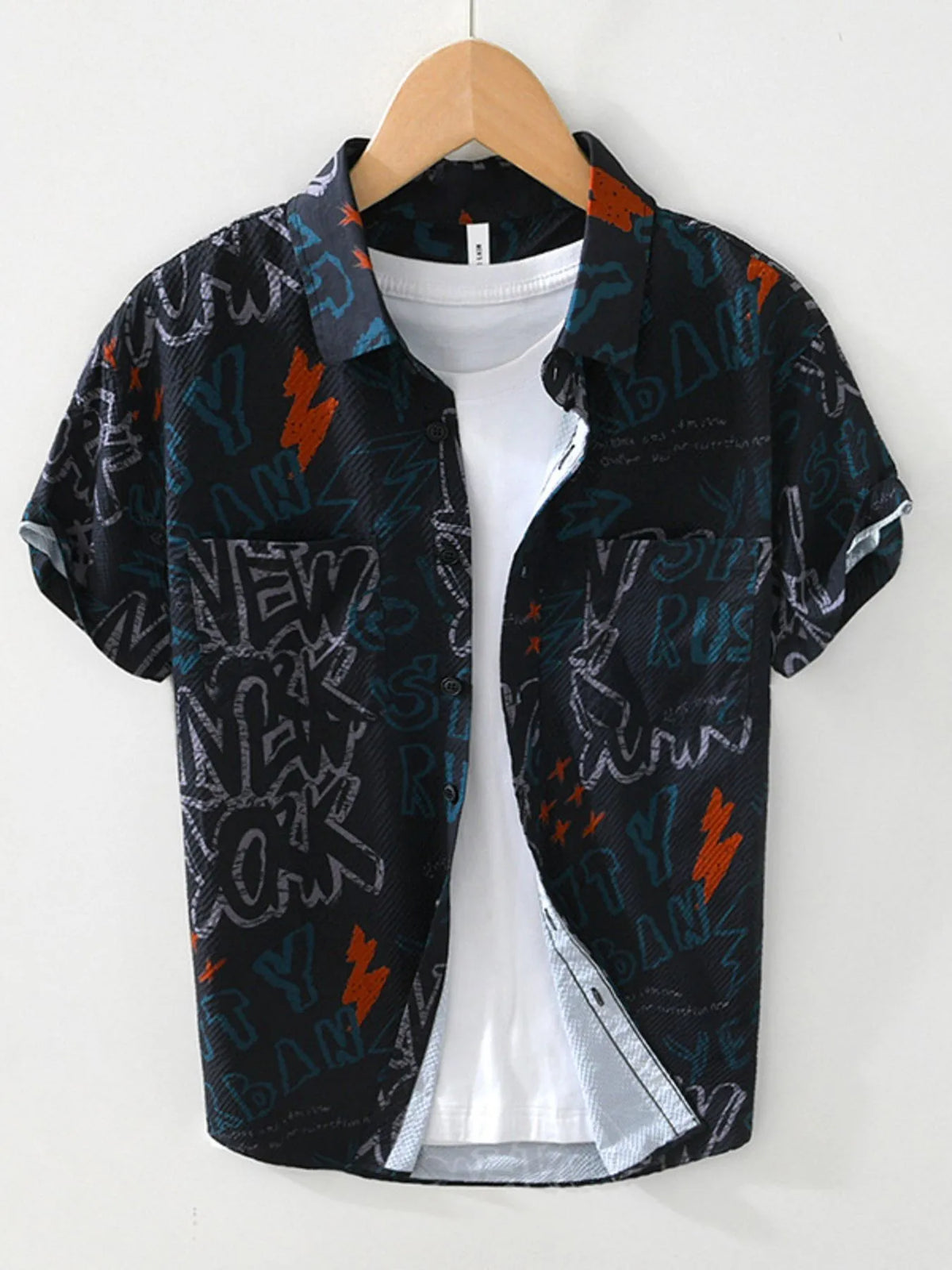 Black shirt with colorful graphics on a hanger against a white background-blackorvani.com