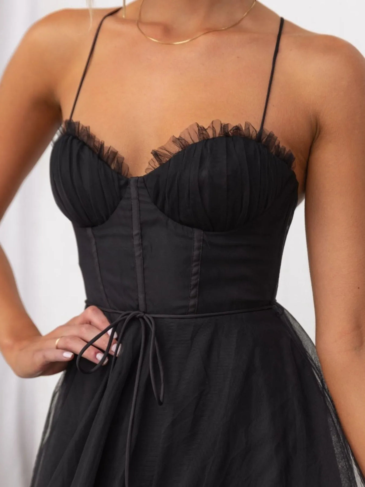 Black dress with sheer lace detailing on a white background-blackorvani.com