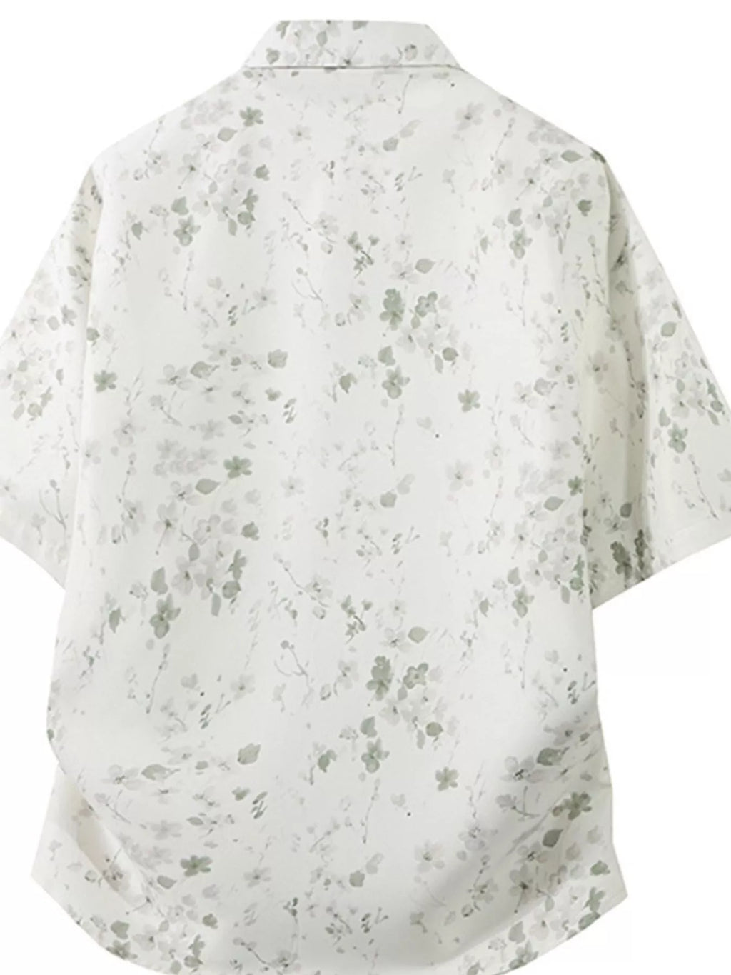 White shirt with subtle gray floral pattern on a white background