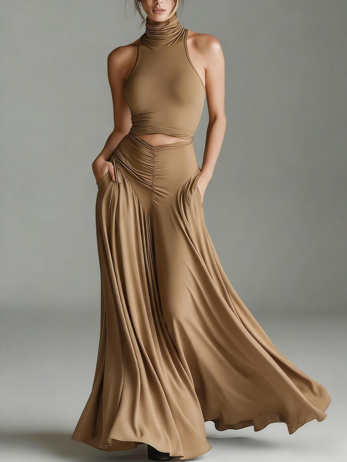 Woman wearing a flowing brown dress against a neutral background
