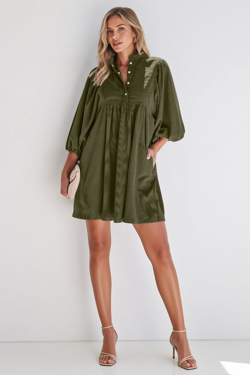 A women modeling a green short dress-blackorvani