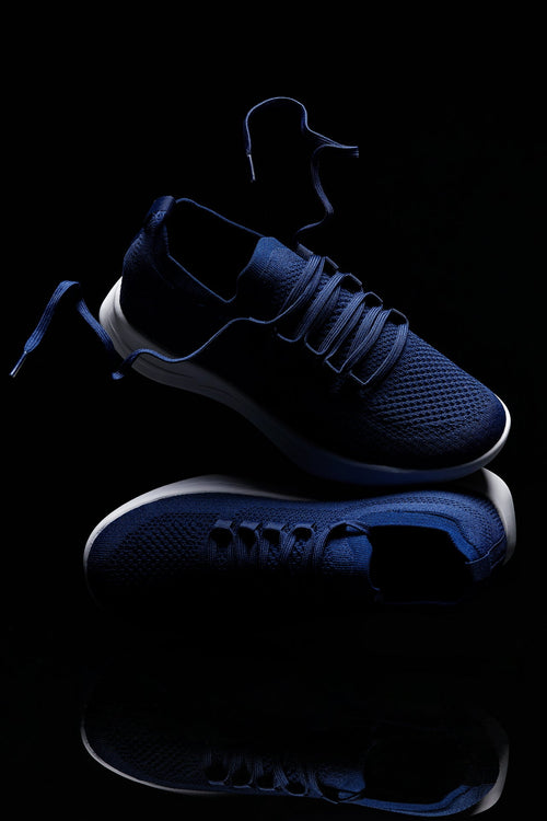 Blue sneakers on a black background-blackorvani