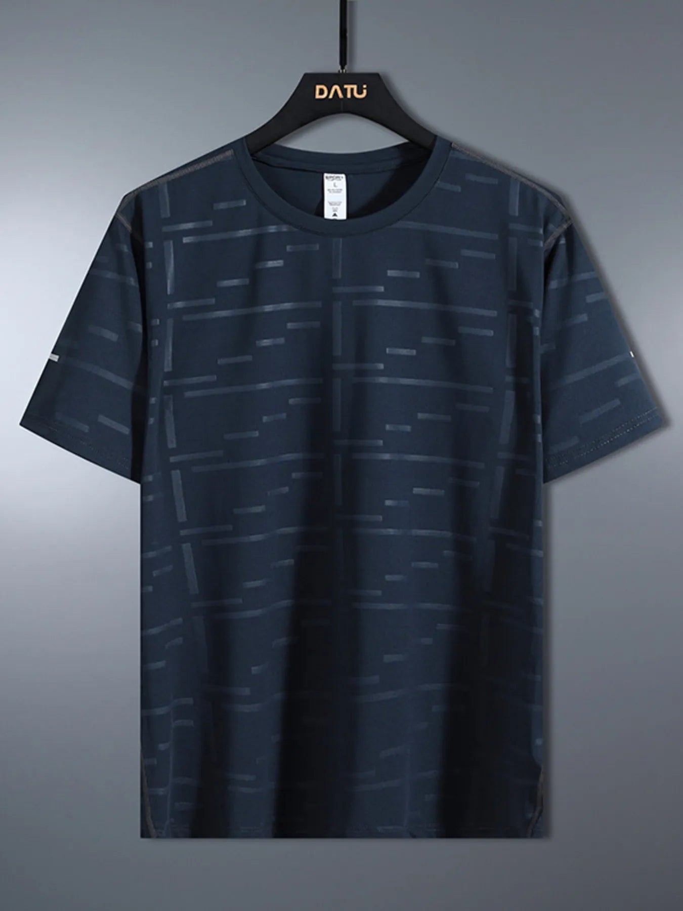 Navy blue t-shirt with subtle pattern on a hanger against a gray background-blackorvani.com
