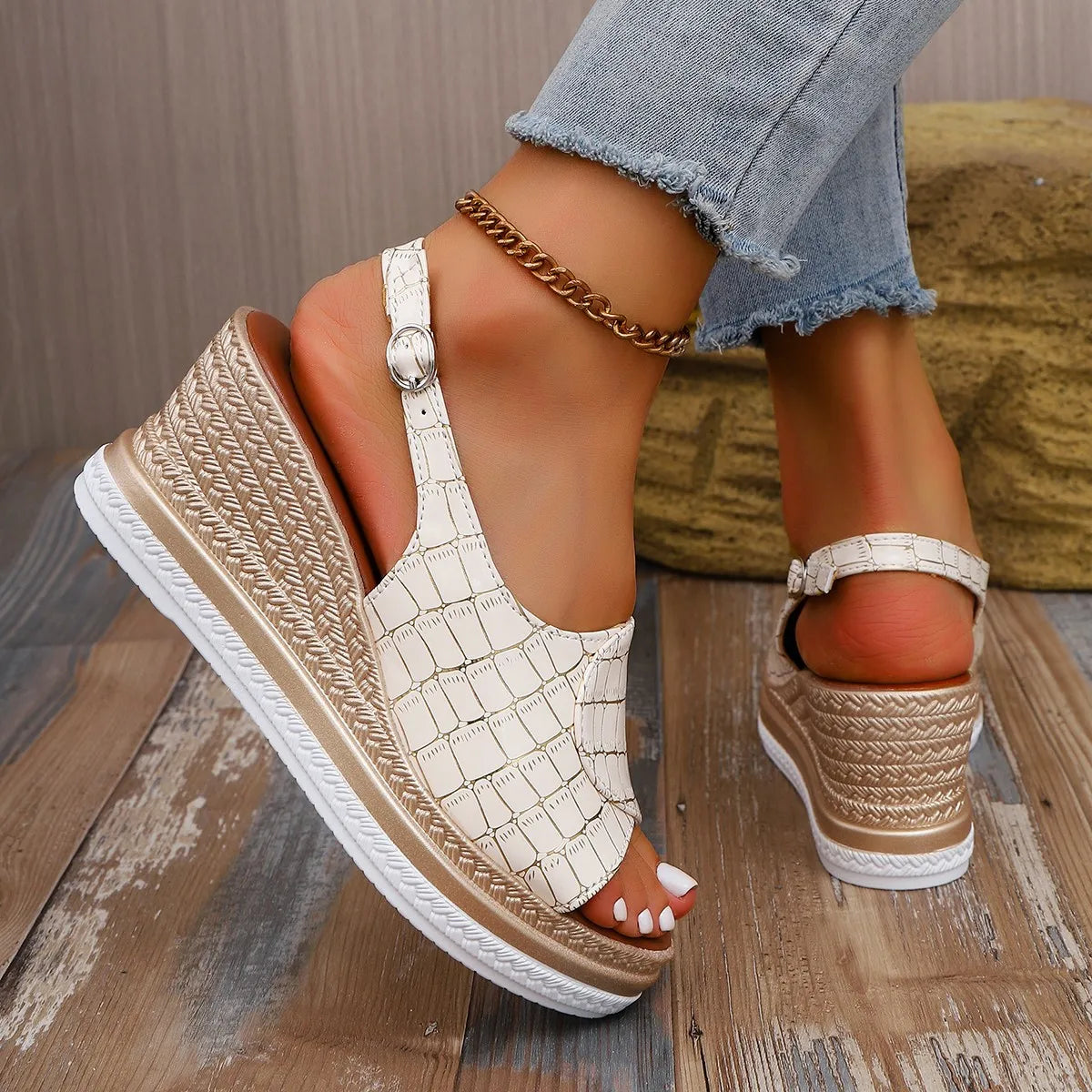 Beige wedge sandals with chain detail worn by a person sitting on a wooden floor-blackorvani.com