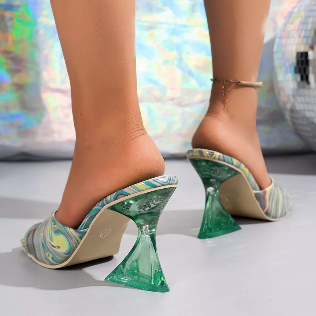Green high-heeled shoes with a marbled pattern worn by a person on a reflective surface-blackorvani.com