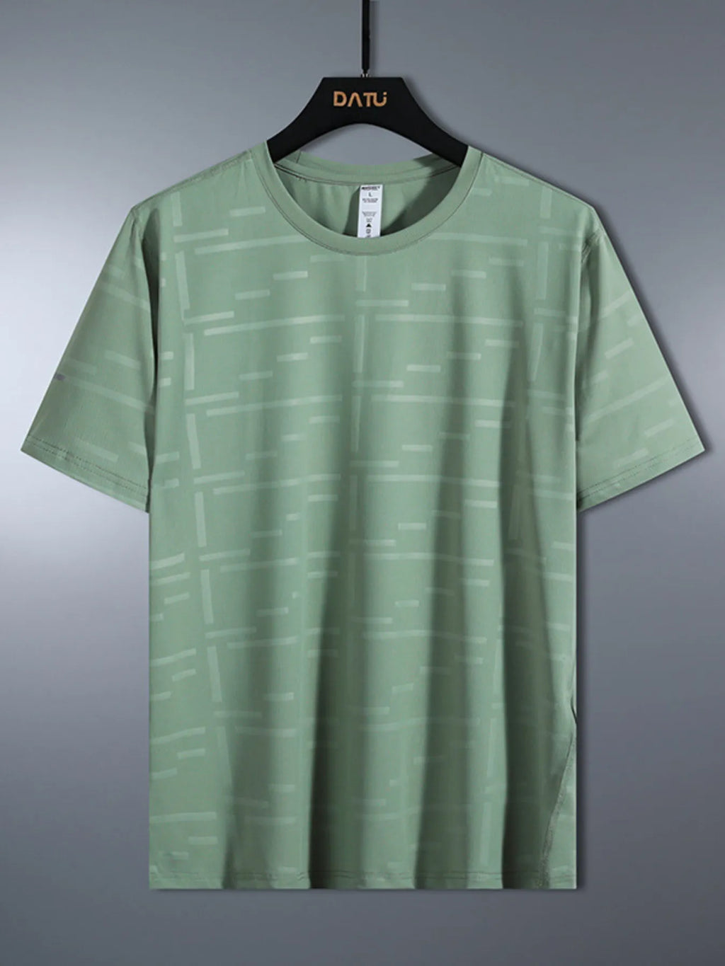 Green t-shirt on a hanger against a gray background-blackorvani.com