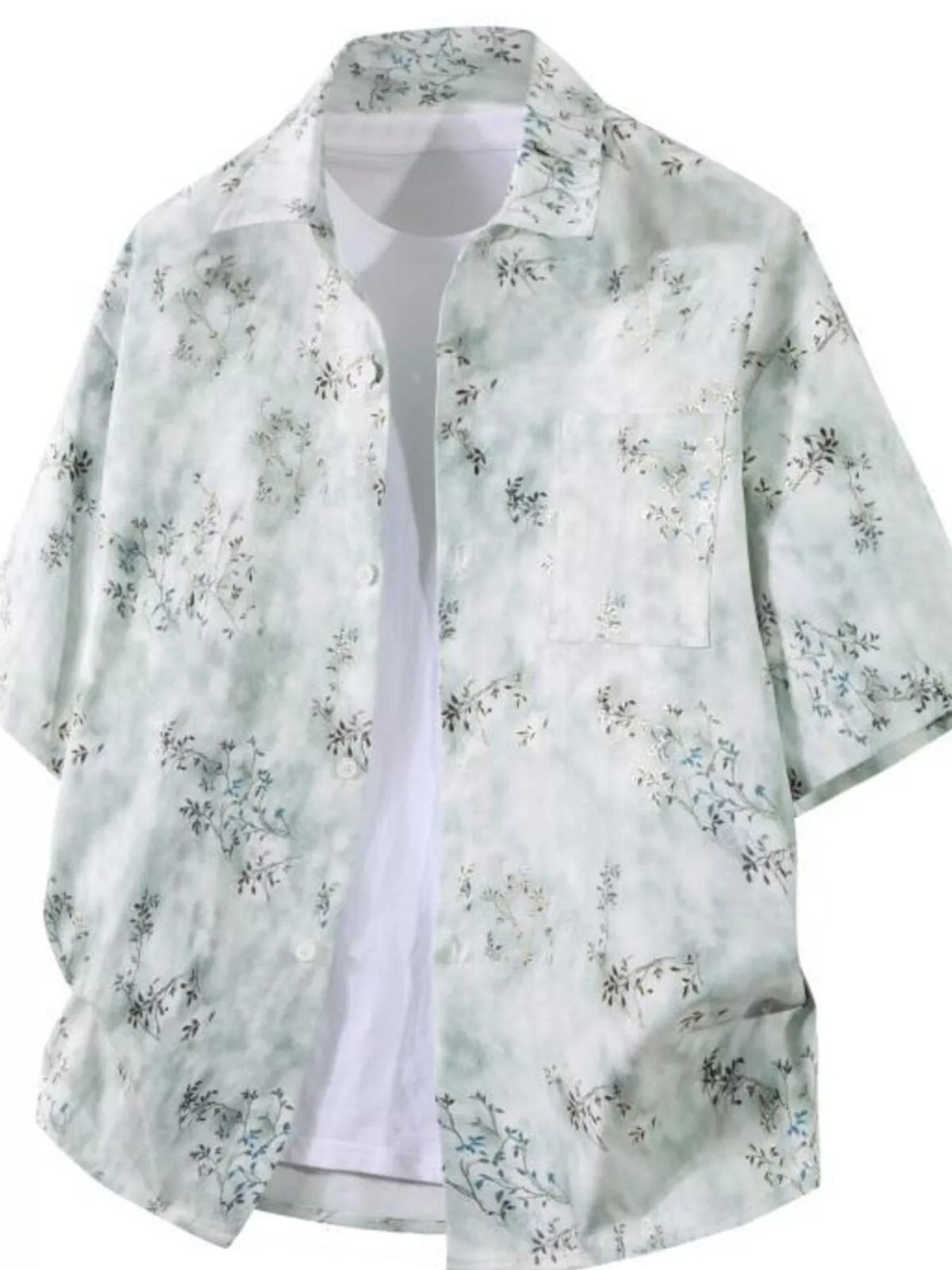 Light green floral shirt over a white shirt on a white background