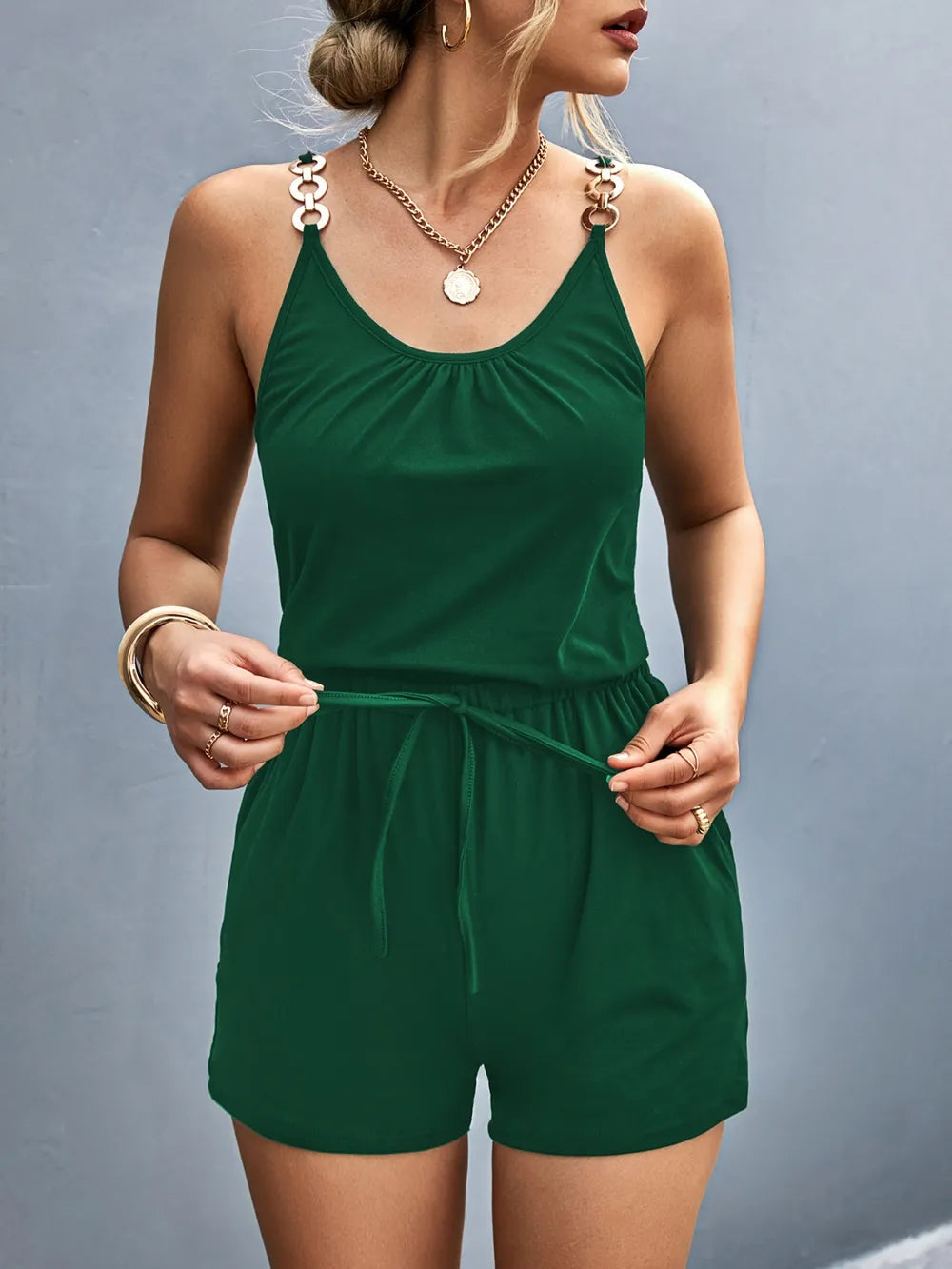 Green romper worn by a person on a gray background-blackorvani.com