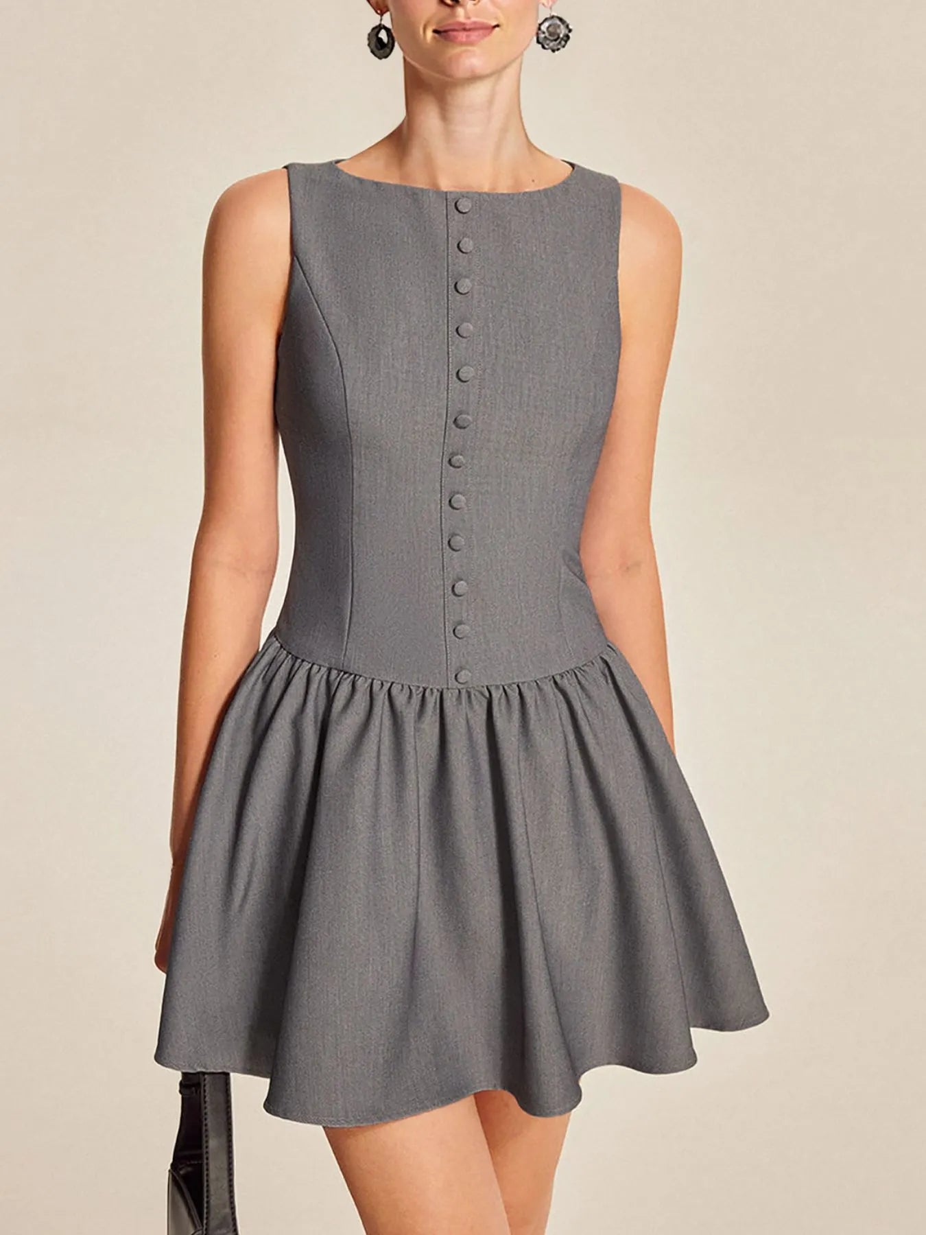 Gray sleeveless dress with button details on a beige background-BlackOrvani