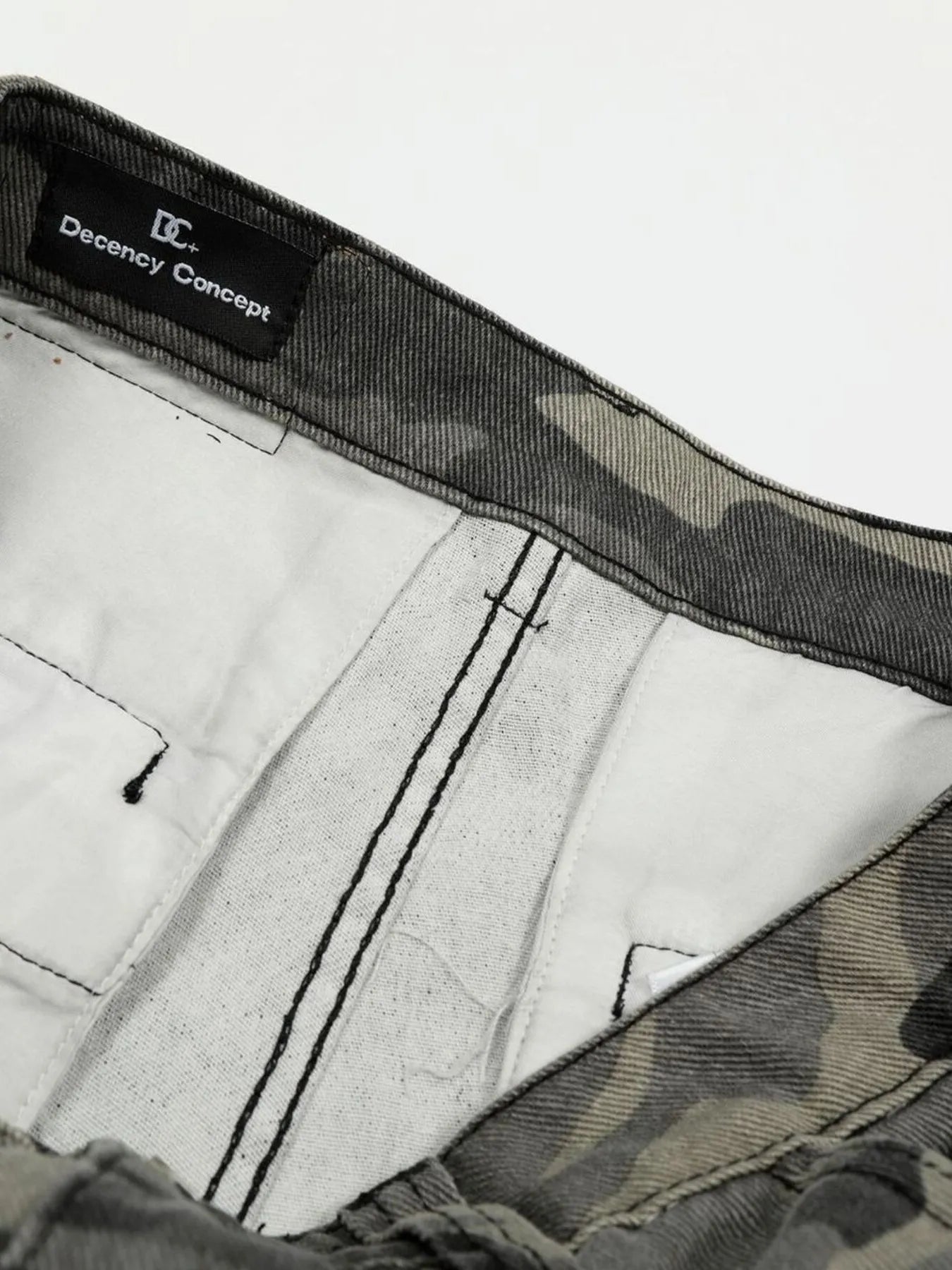 Close-up of underwear with 'Decency Concept' label -Black Orvani