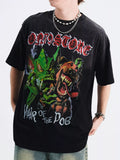 boy wearing a black t-shirt with 'Bad Seed' and 'Hair of the Dog' graphic design-Black Orvani