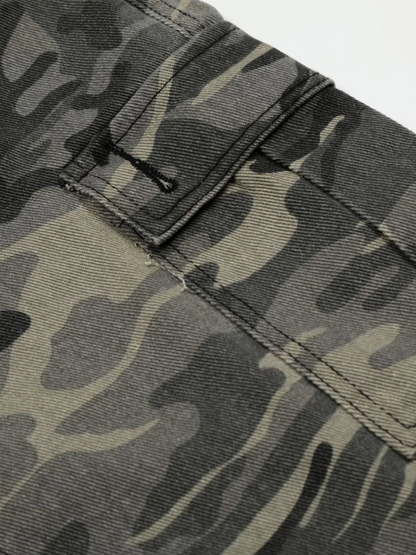 Close-up of camouflage pants with a focus on texture and pattern-Black Orvani