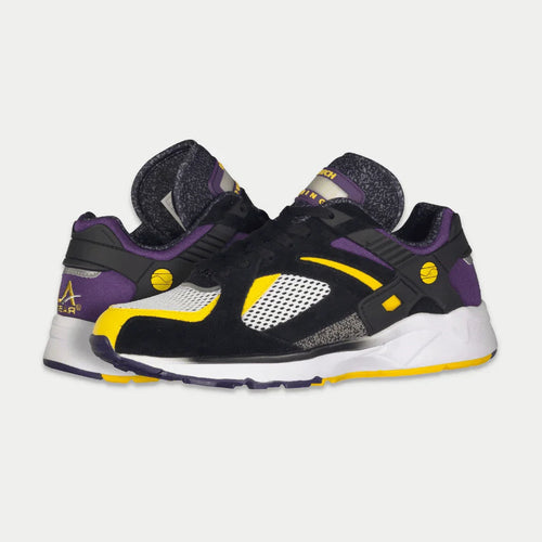 Black, purple, and yellow sneakers on a light gray background