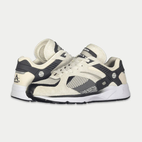 Pair of white and black sneakers on a light gray background