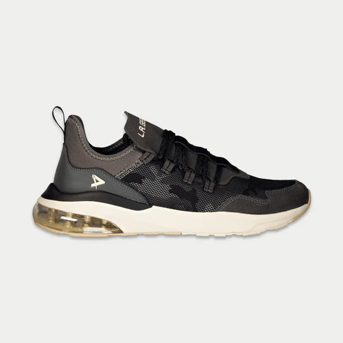 Black and gray sneaker with a visible brand logo on a light gray background